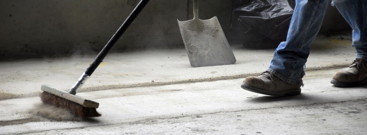 Man cleaning house under construction.